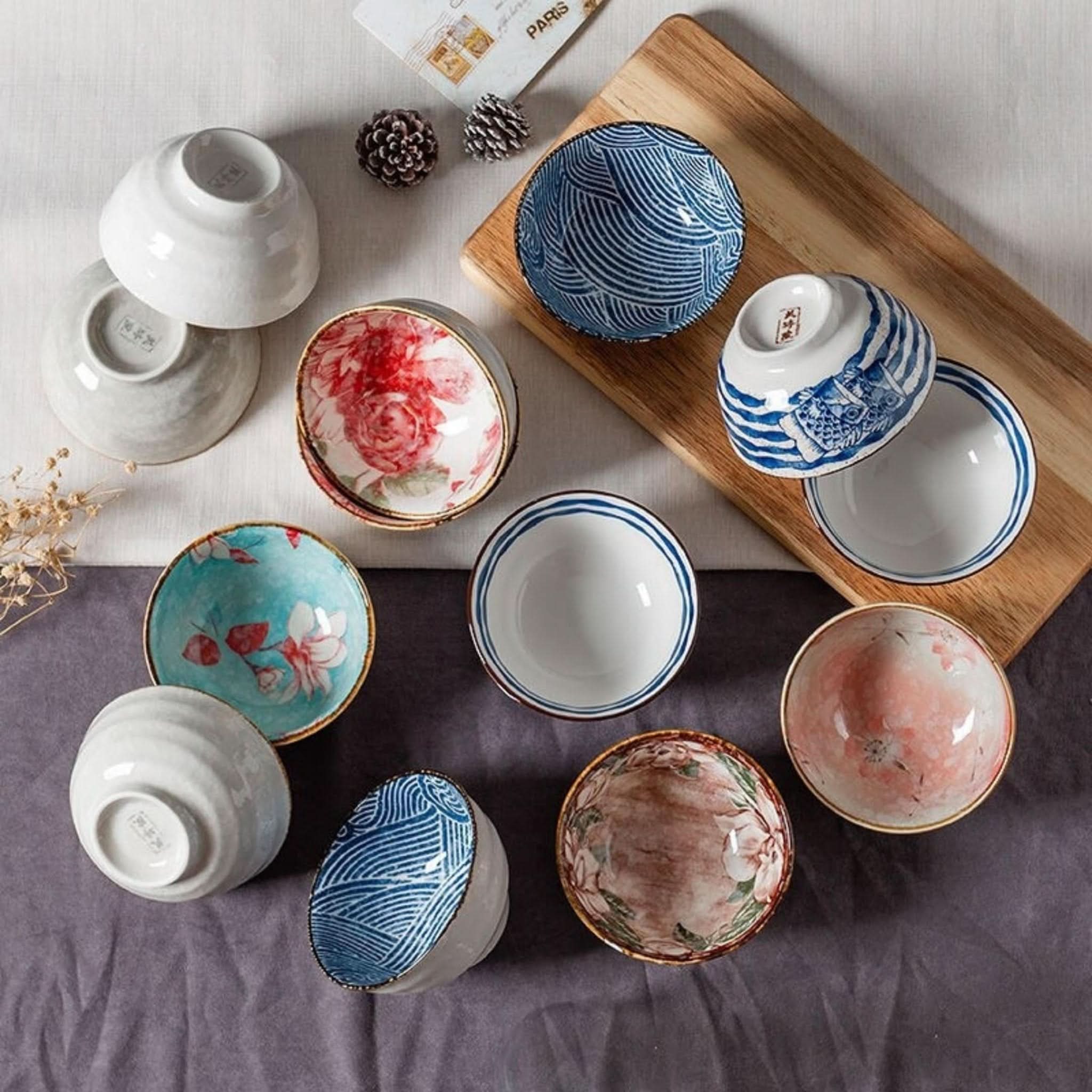 Ceramic glazed 4.5" bowls with Japanese illustrations. Assorted designs & colors.